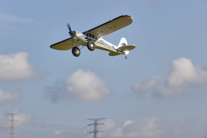RC aircraft flying above power lines demonstrating airspace
