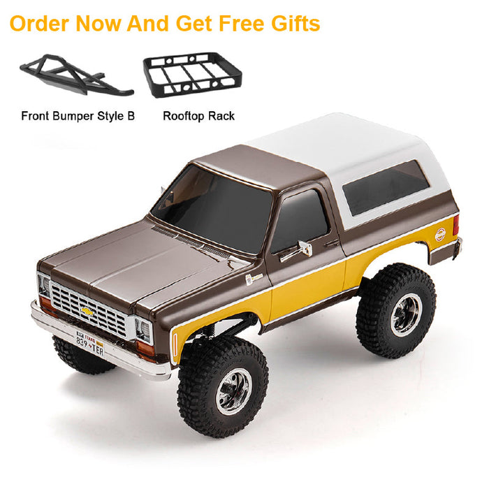 FMS 1:24 FCX24 Chevrolet K5 Blazer RTR in brown and yellow, with included front bumper and rooftop rack.