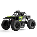 FMS 1:24 FCX24 Lemur RTR rock crawler with black and green design on white background.