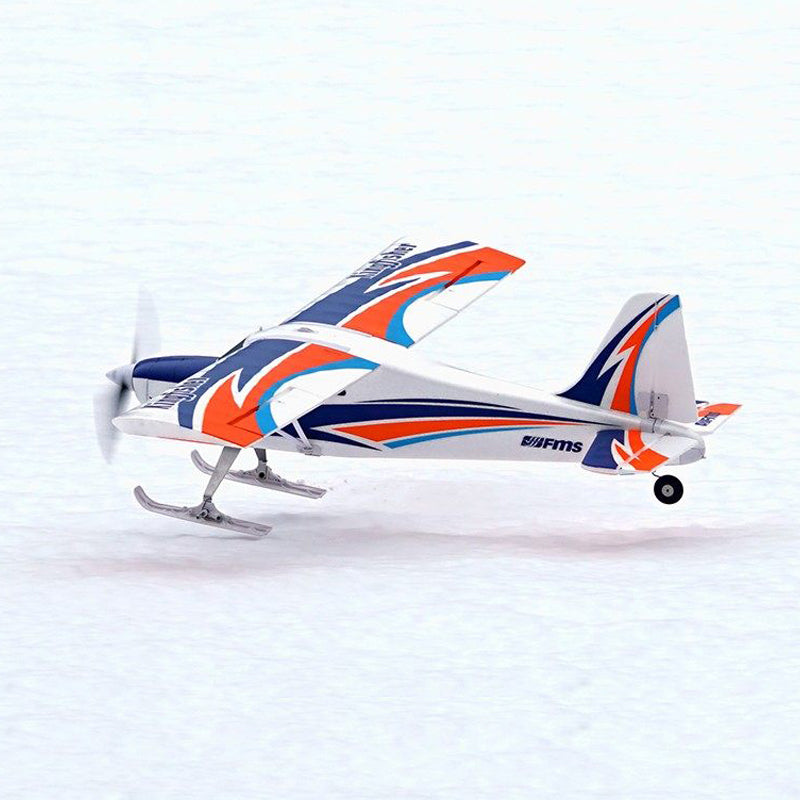 FMS Kingfisher PNP airplane soaring with ski landing gear on snowy surface