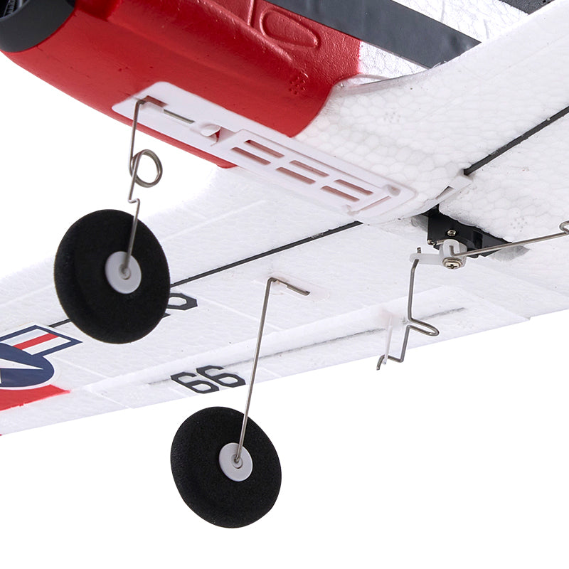 Close-up of a model airplane with red, white, and blue colors on a white background