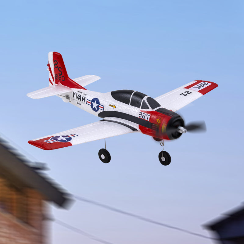 Model airplane flying against a clear blue sky