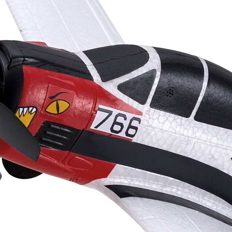 Close-up of a shoe with a red, black, and white design featuring the number 766 and a cartoonish face.