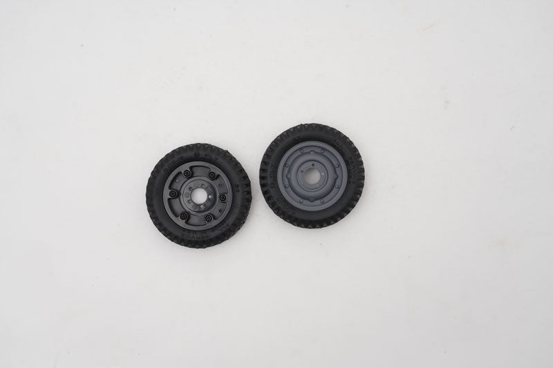Assembled 1:12 Toyota FJ45 RC model wheels (2 pcs) with black tires.