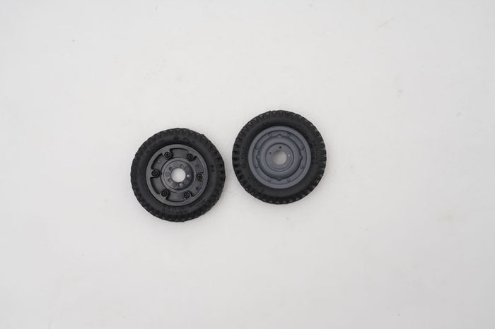 Assembled 1:12 Toyota FJ45 RC model wheels (2 pcs) with black tires.