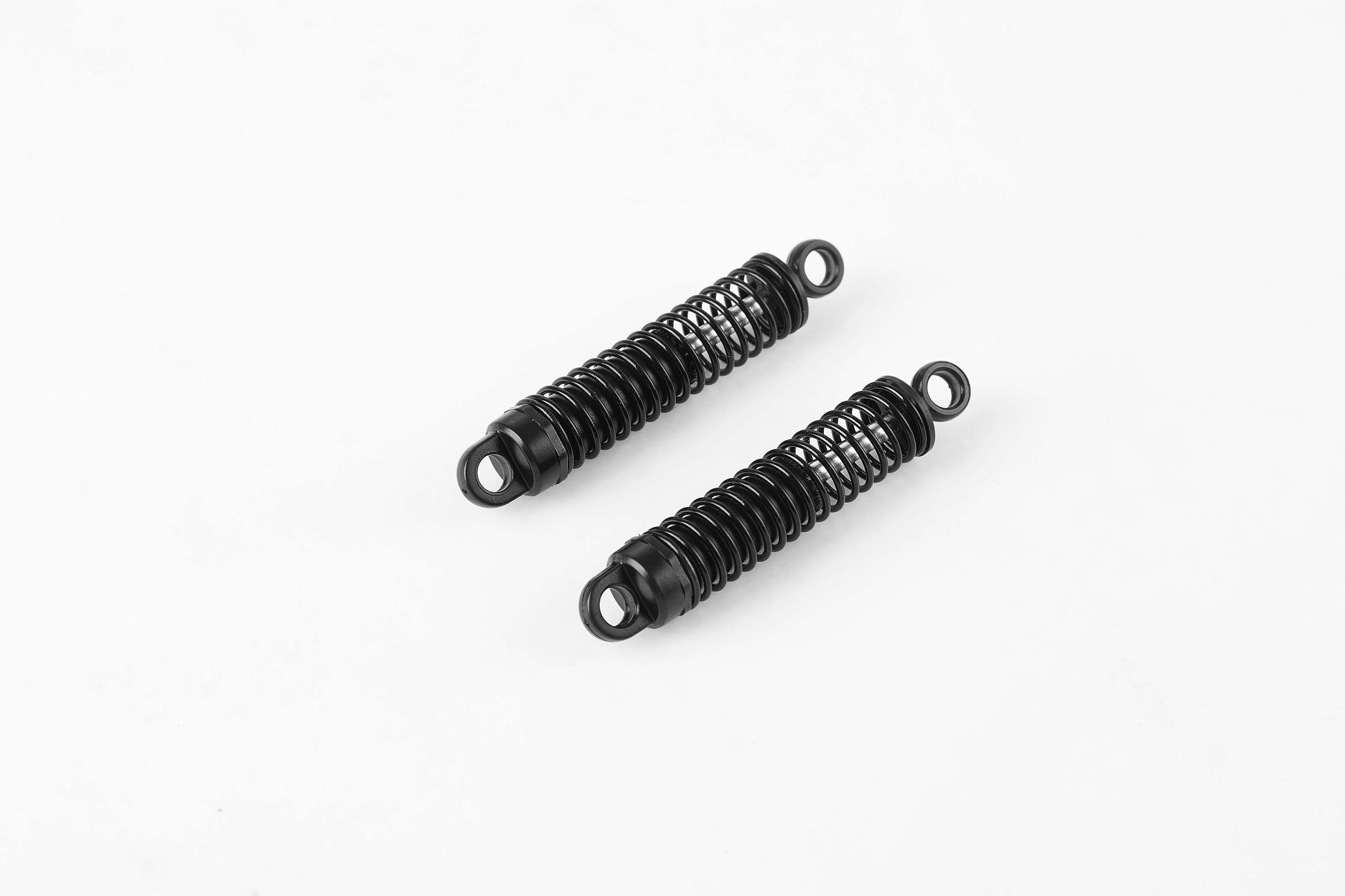 Front oil shock absorbers assembly for 1:10 Toyota FJ40 RC model.