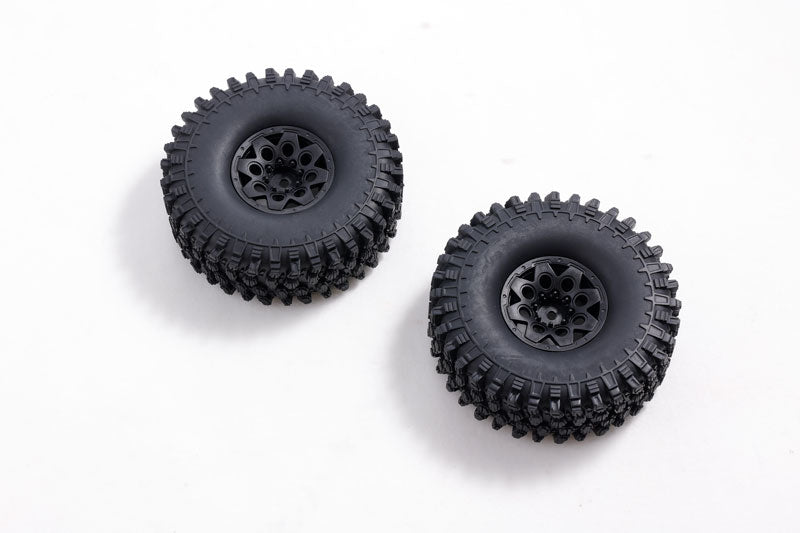 Black climbing wheels for RC vehicles with deep treads and detailed design.
