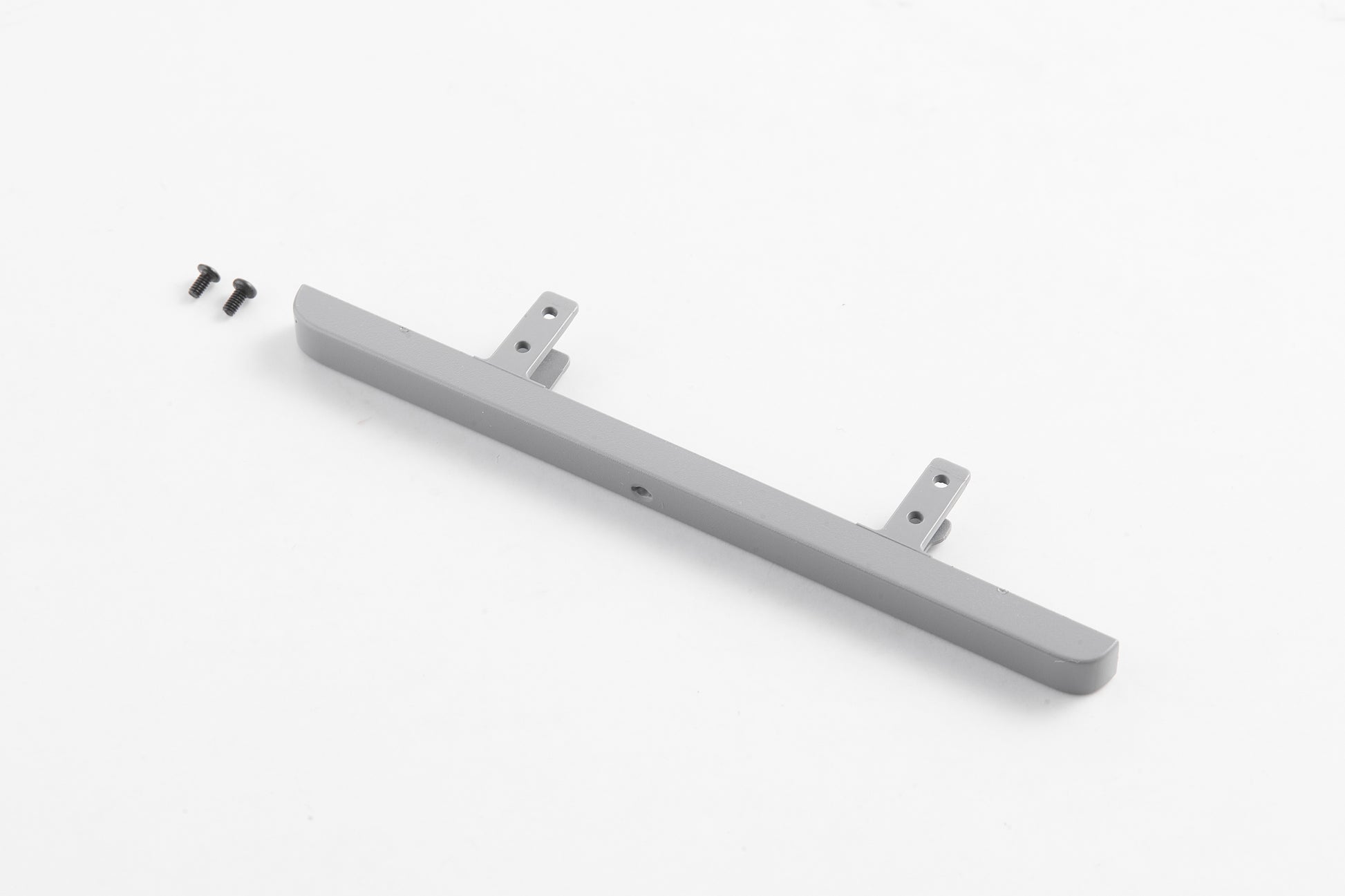 Gray front bumper for 1:12 Land Rover model with mounting brackets and screws