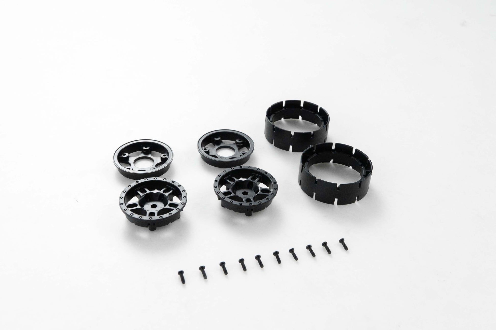 Black RC wheel parts set with screws for assembly