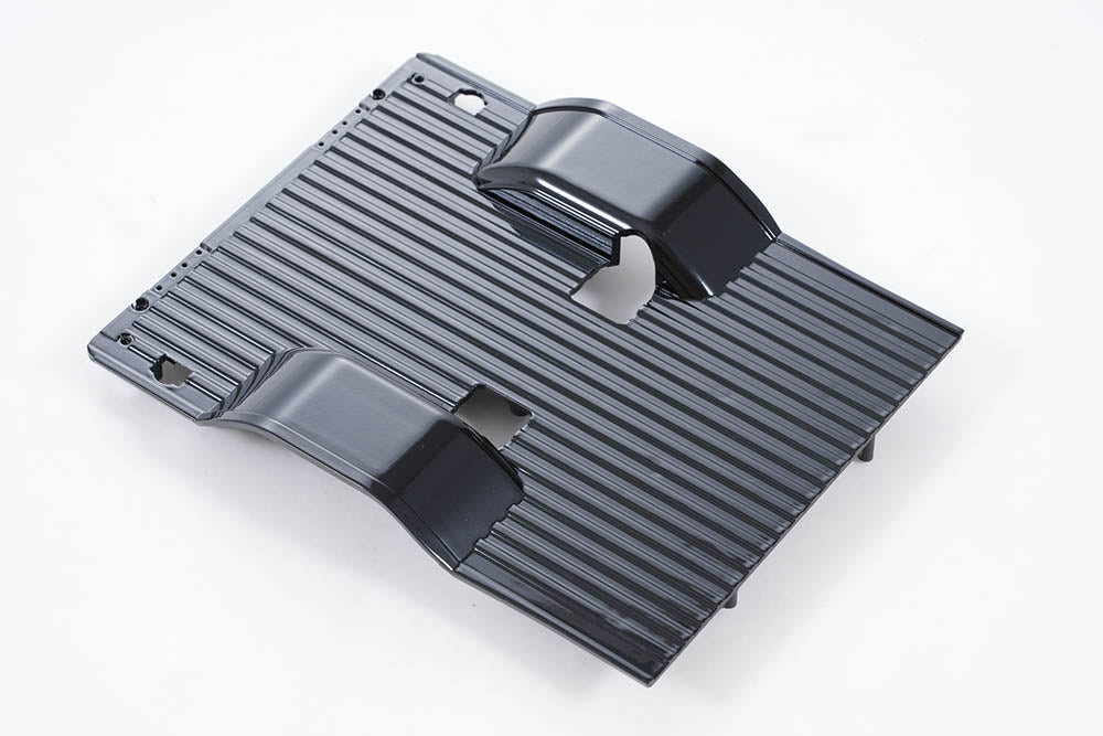 Black FCX18 K10 chassis for RC vehicles with ribbed surface