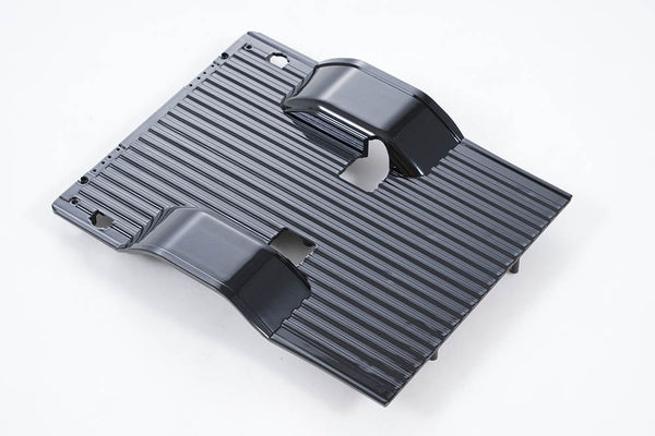 Black FCX18 K10 chassis for RC vehicles with ribbed surface