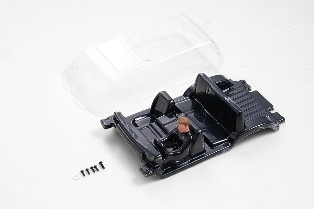 FCX18 Land Cruiser 80 cockpit with driver figure and assembly screws