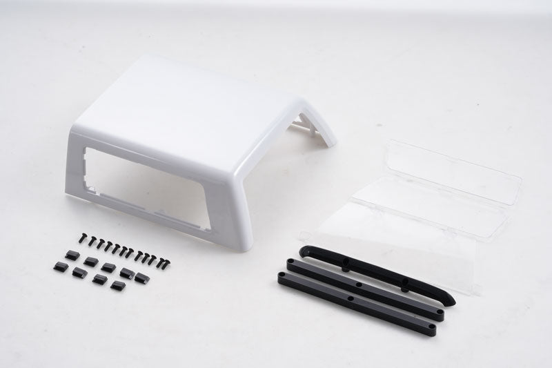 Black and white Chevrolet K5 Blazer hopper cover with window and parts