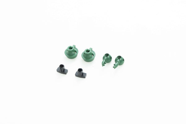 Green and black parts for RC model assembly, including cup set components.