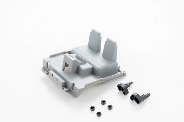 Gray RC vehicle part with mounting clips and screws for assembly.