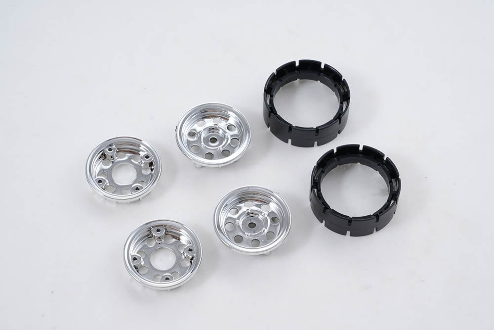 RC vehicle plastic wheel parts set in silver and black, suitable for custom builds.