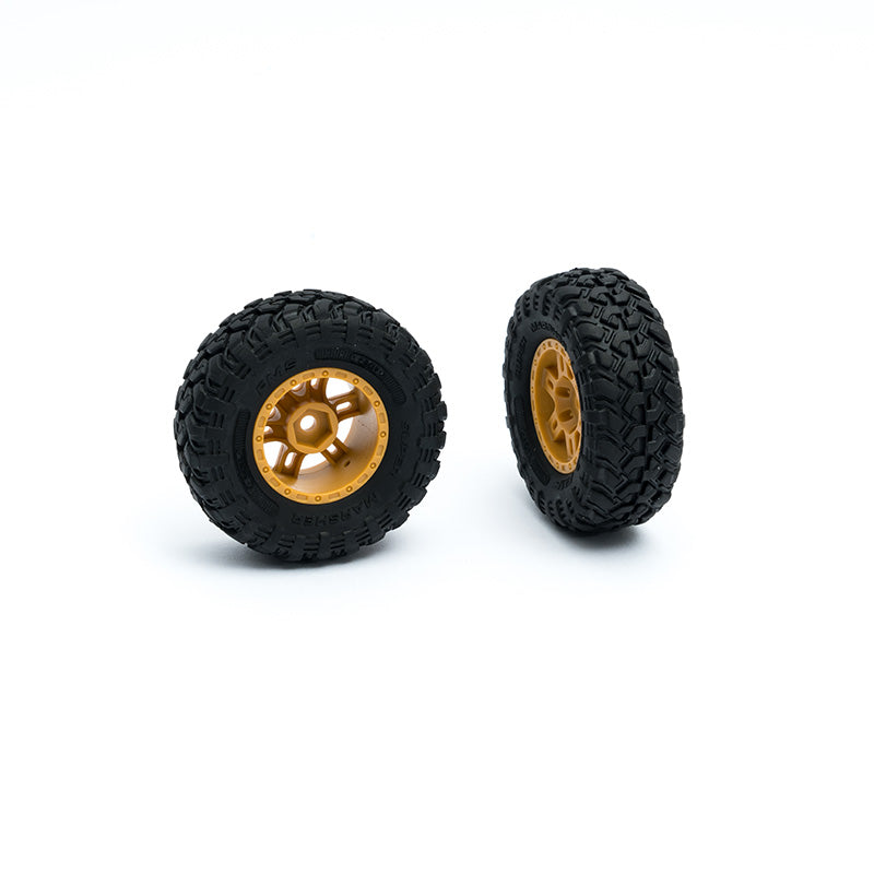 RC truck tire set with black rubber and gold rims for enhanced performance