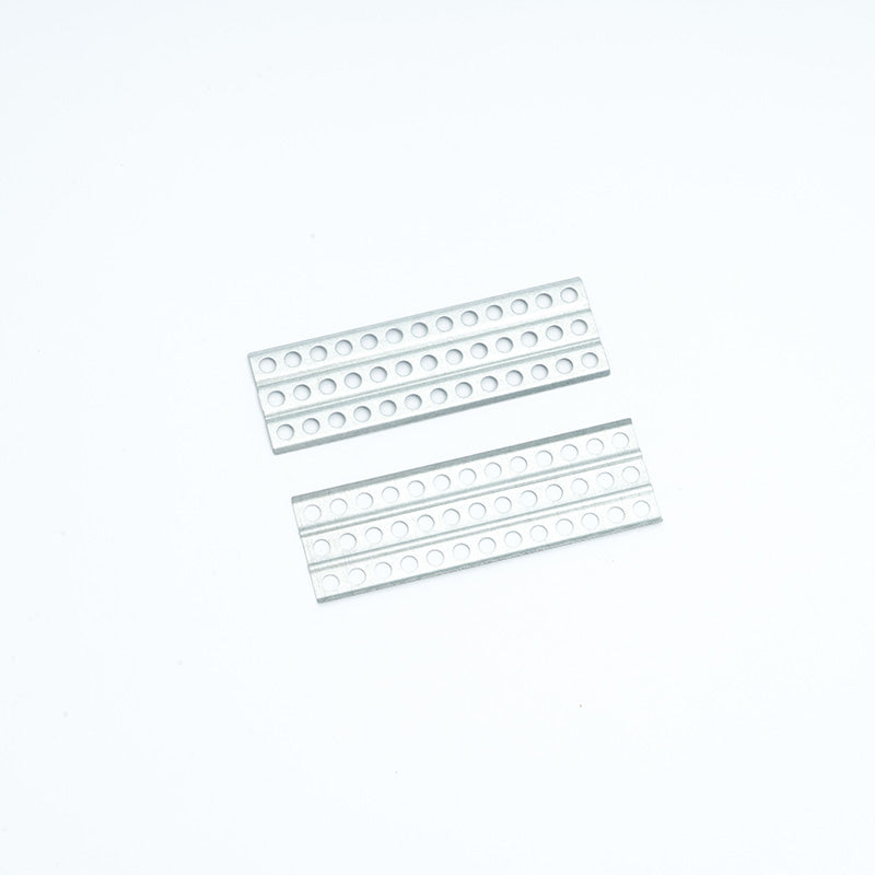 Silver upgrade parts for RC model assembly with multiple perforations.