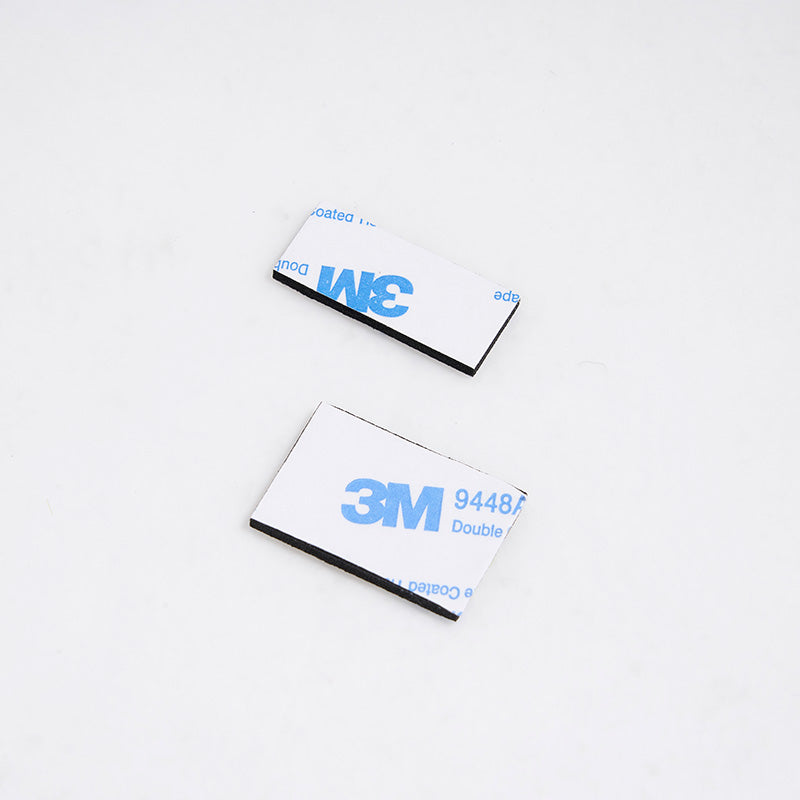 Double-sided gummed tape pieces by 3M for mounting and crafting