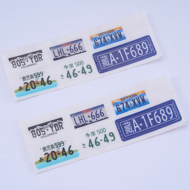 Set of toy license plates including Colorado and Nevada designs for RC vehicles