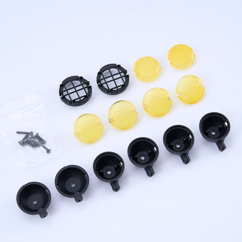 FCX10 Toyota LC80 spotlight set parts: yellow and black lens covers, screws.