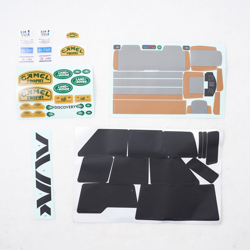 FCX10 Discovery decal sheet set with Camel Trophy, Land Rover graphics, license plates, and model parts.
