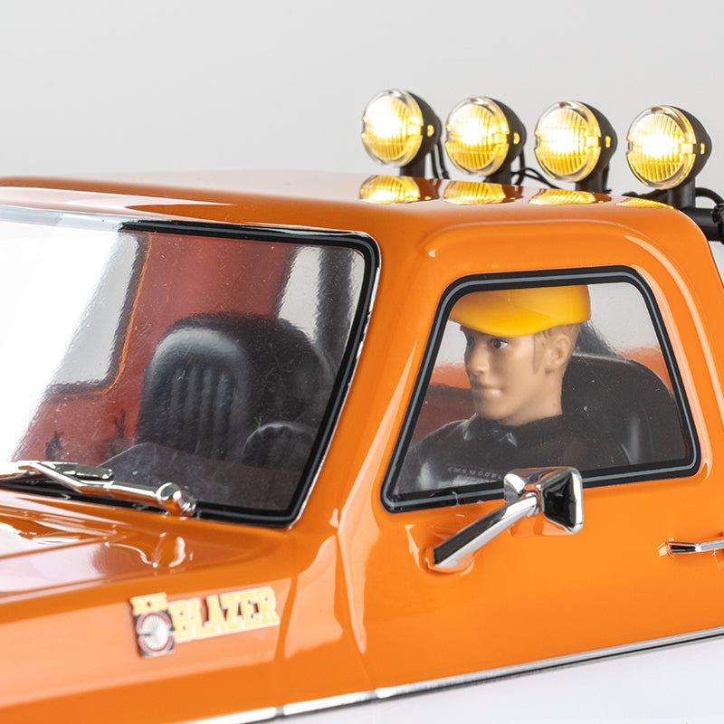 Orange 1:10 Chevrolet K5 Blazer with driver figure and roof-mounted lights