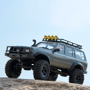 FMS 1:18 FCX18 LC80 Toyota Land Cruiser 80 V2 RTR in gray on rocks