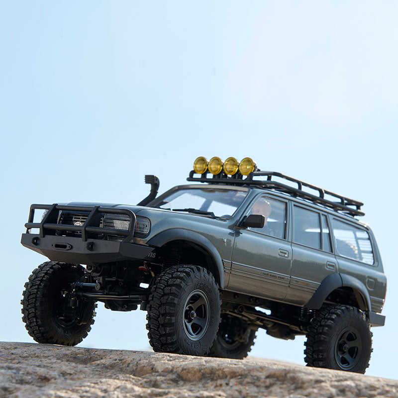 FMS 1:18 FCX18 LC80 Toyota Land Cruiser 80 V2 RTR in gray on rocks