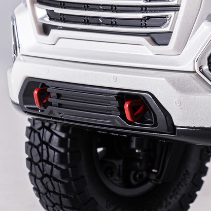 White 1:18 GMC Sierra S RTR RC truck front bumper, black grille, red tow hooks, knobby tire.