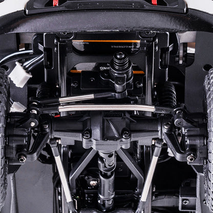 Underside view of 1:18 GMC Sierra S RC truck chassis with metal suspension and drivetrain.