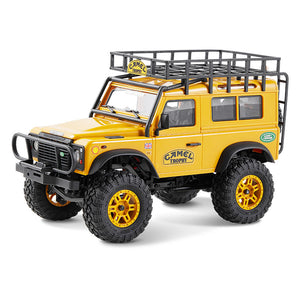 FMS 1:24 FCX24M Land Rover Camel Trophy Edition RTR crawler with roof rack and yellow accents.