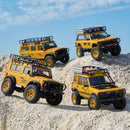 Yellow Land Rover Camel Trophy Edition RC models on rugged terrain