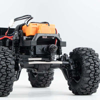 FMS 1:24 Power Wagon chassis with brushless motor, portal axles, and rugged tires.