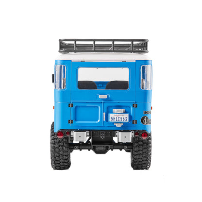 FMS 1:10 blue Toyota Land Cruiser FJ40 RS rear view with roof rack and California license plate '5HLC563'.