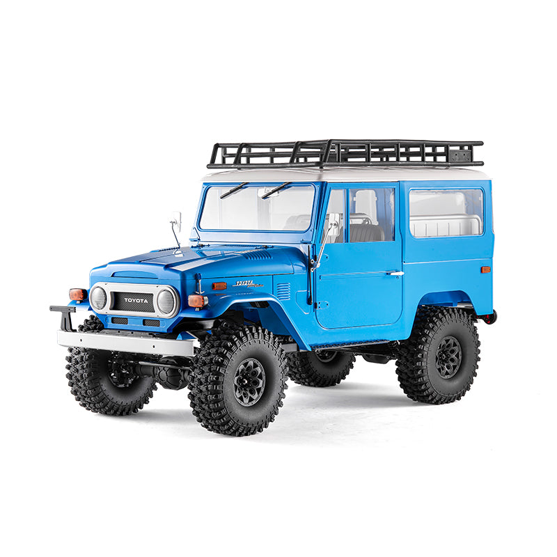 Blue FMS 1:10 Toyota Land Cruiser FJ40 RS RC rock crawler with roof rack and off-road tires