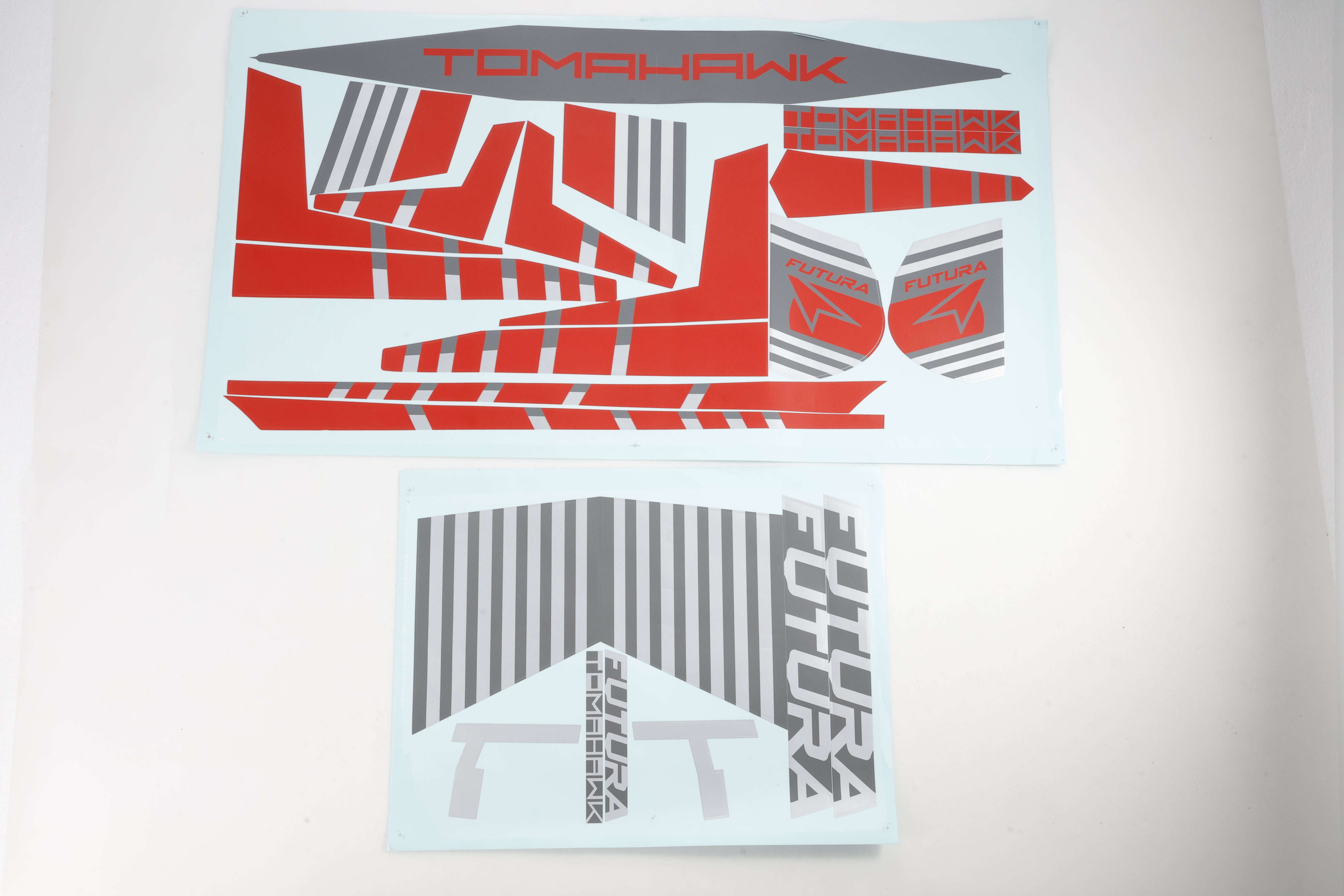 Futura and Tomahawk RC model sticker sheets in red and grey designs.