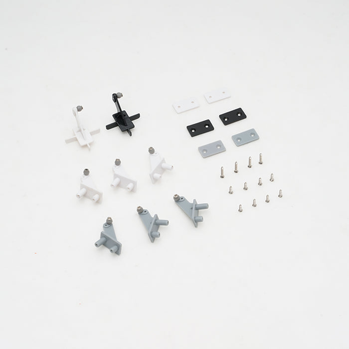 Assorted control horns and screws for RC models in black, white, and gray.