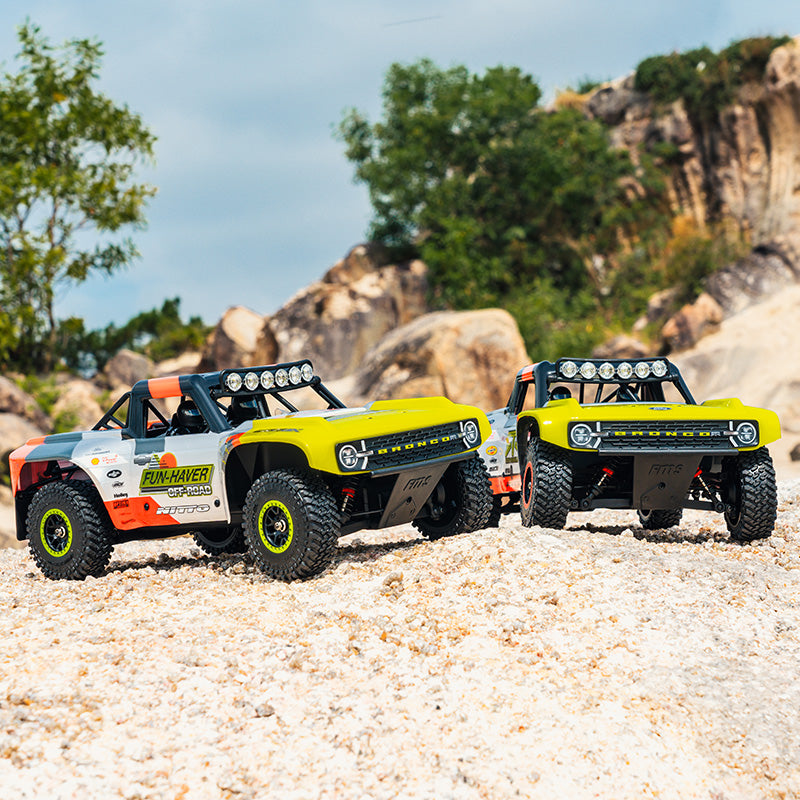 Two FMS 1:18 Ford Bronco RTR EB Fun-Haver off-road trucks.