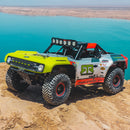 Off-road vehicle on a rocky terrain with a body of water in the background