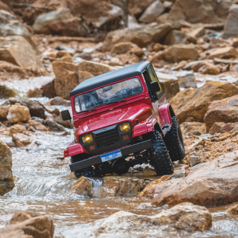 ROCHOBBY 1:10 Mashigan RC Rock Crawler RS Red 4WD navigating rocky stream