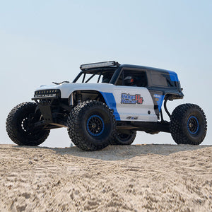 ROCHOBBY 1:7 Ridge Racer U4 desert buggy RC car with blue and white graphics, large tires, and light bar.