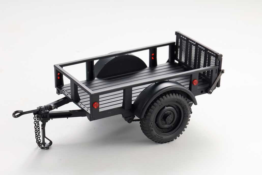 Realistic black RC utility trailer with sturdy wheels and detailed design for hobby enthusiasts.