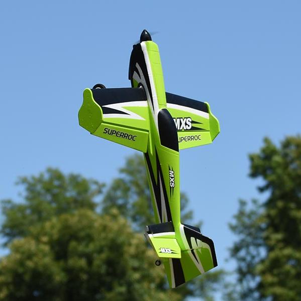 FMS 1100mm MXS V2 performing aerobatics in vibrant green.