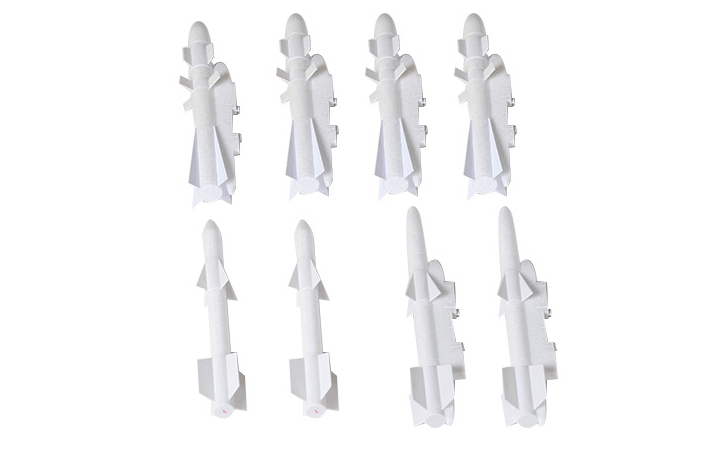 8 white model bombs and missiles for RC aircraft, ideal for enhancing realism.