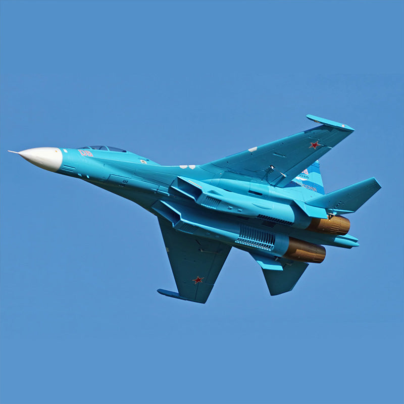 FMS Dual 70mm EDF SU-27 / J-11 PNP model jet in flight, blue with red star insignia.