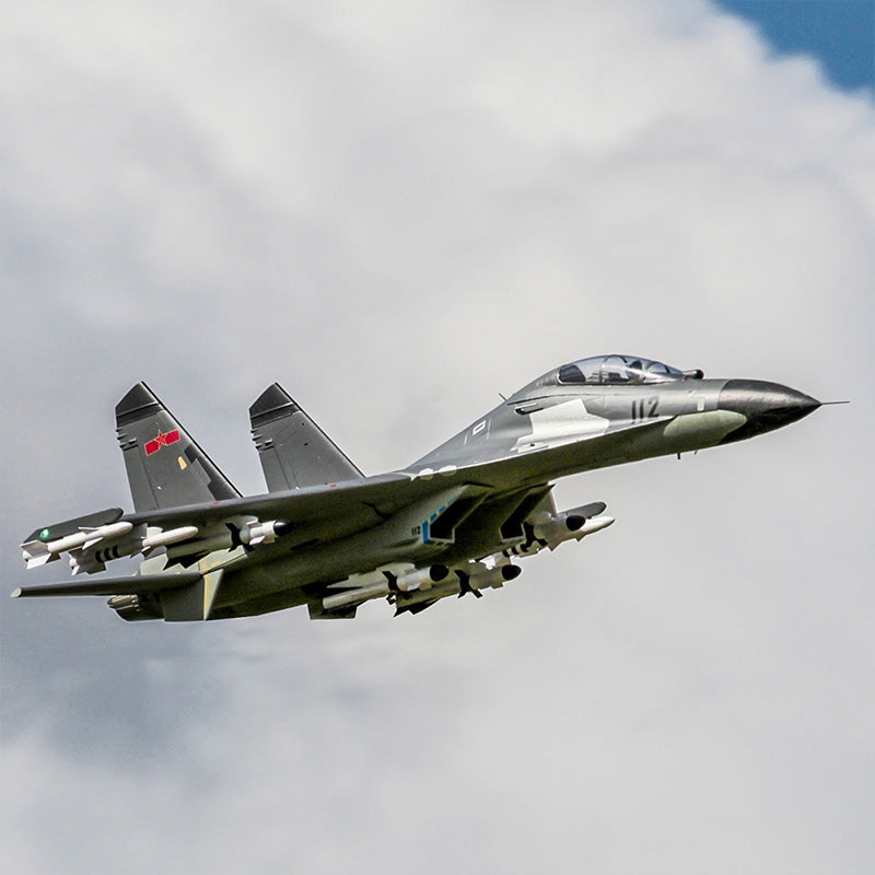 FMS Dual 70mm EDF SU-27 / J-11 PNP model jet in flight with detailed features and camouflage paint scheme.