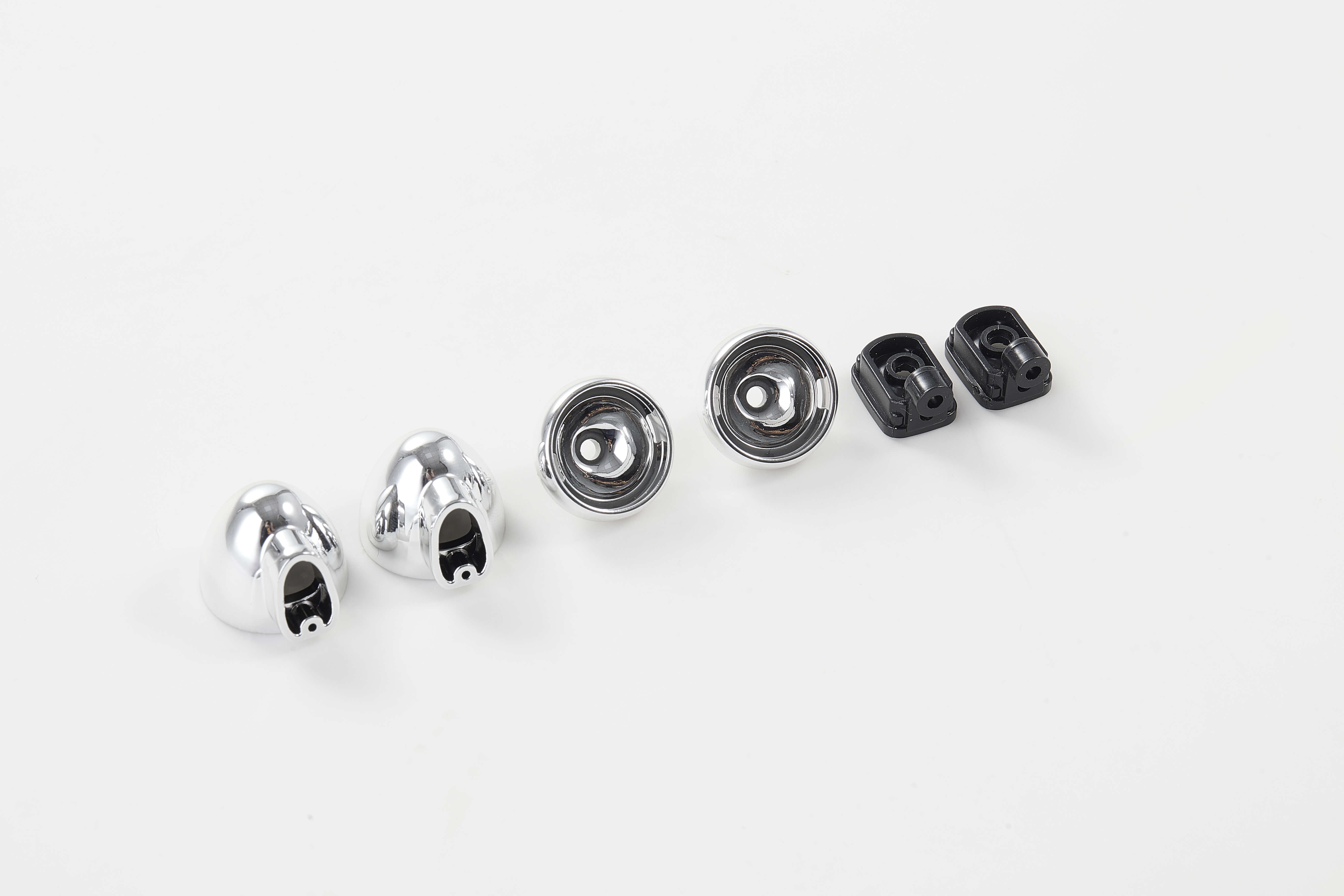 Chrome and black RC car body parts including mounting brackets