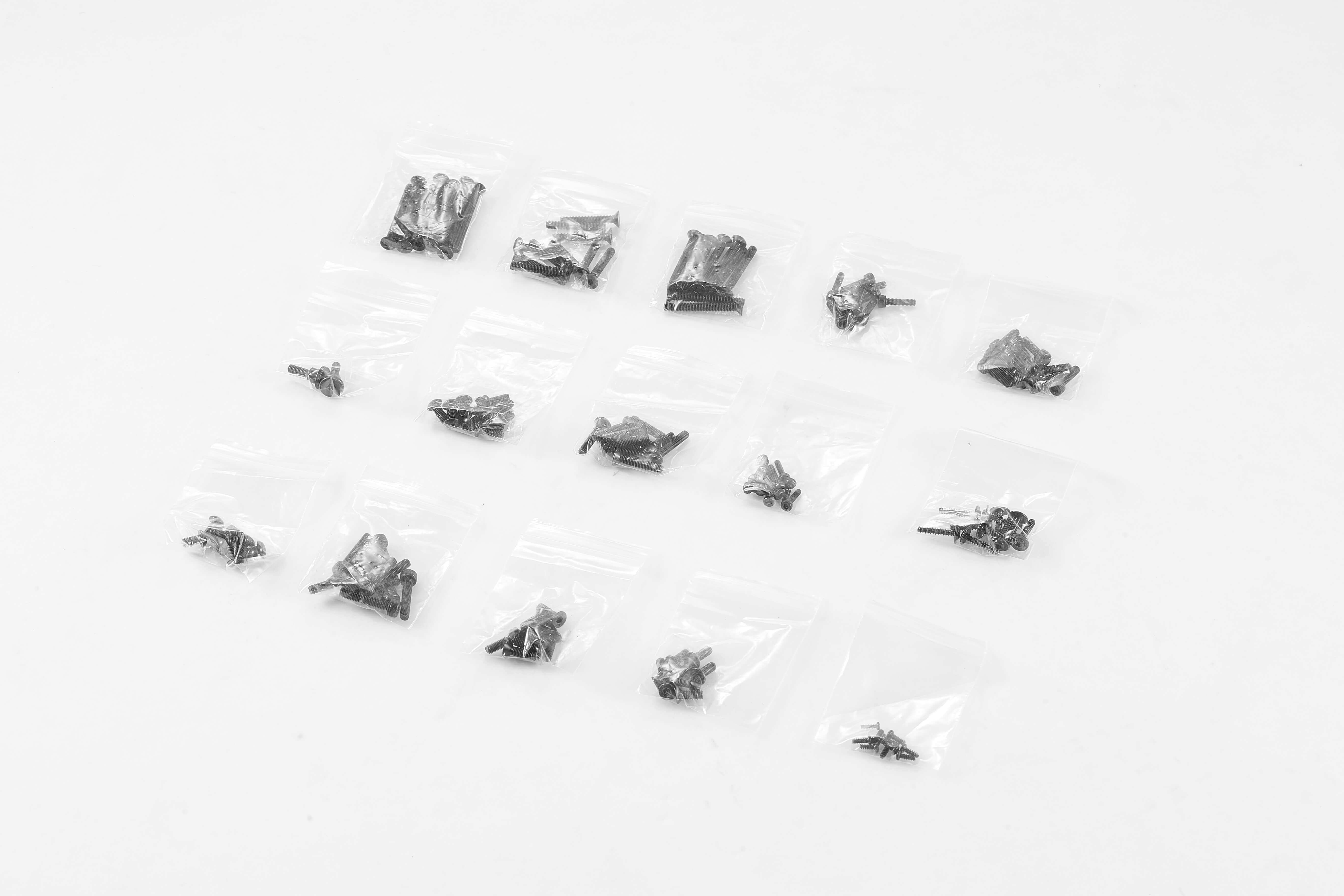 Assorted screw set for 1:10 Atlas 4x4 RC vehicle, packaged in small bags.