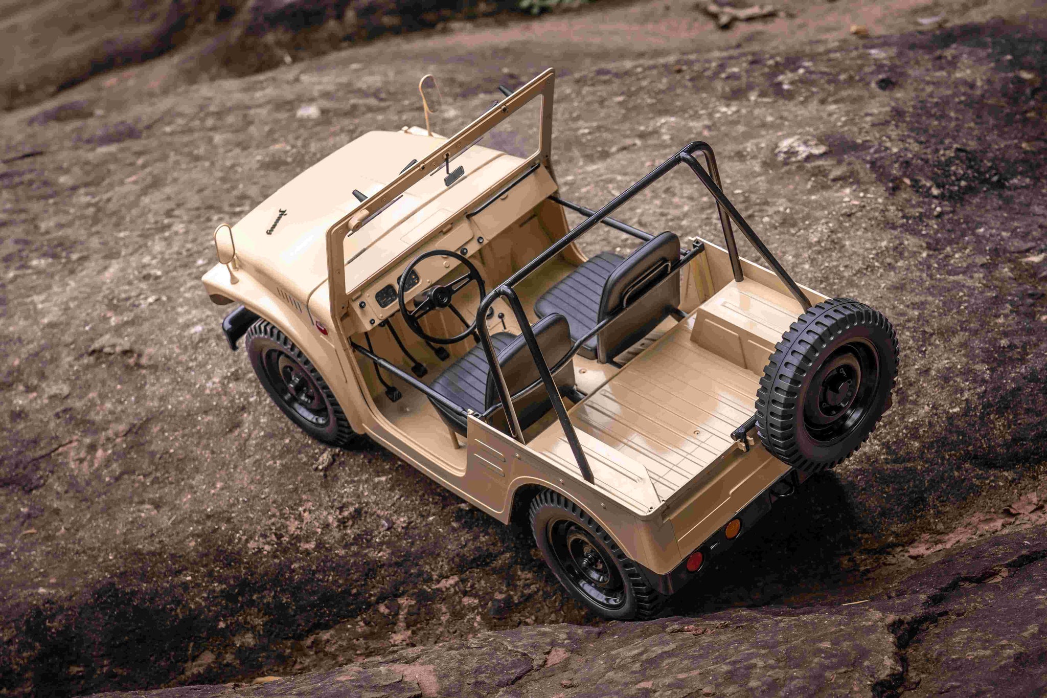 FMS 1:6 scale Jimny RS Brown RC crawler on rocky terrain
